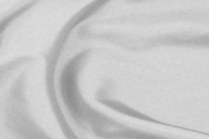 Smooth elegant white silk fabric or satin luxury cloth texture for drapery luxurious abstract design background photo