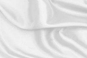 Smooth elegant white silk fabric or satin luxury cloth texture for drapery luxurious abstract design background photo