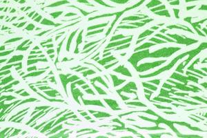 Abstract paper white geometric asymmetrical texture striped surface line on green background. Structure design cardboard shape backdrop. Decoration spring interior concept. Flatlay, close-up, top view photo