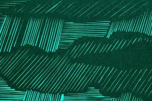 Abstract paper emerald geometric asymmetrical texture striped surface lines background. Structure design cardboard shape backdrop. Decoration holiday interior concept. Flatlay, close-up, top view photo