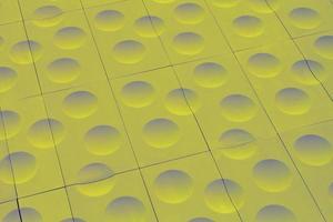 The close-up of green detailed sphere texture reverse side of the plastic tile. Rough embossed lattice. Concept of design. Wall decoration interior. Relief balls geometric pattern. Flatlay, mock up photo
