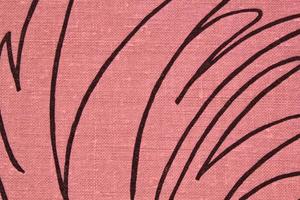 Abstract design background of pink coarse-grained intersection texture of rough fabric with an interlacing black painted lines. Linen sack textile canvas burlap cloth. Close-up, mock up, top view photo