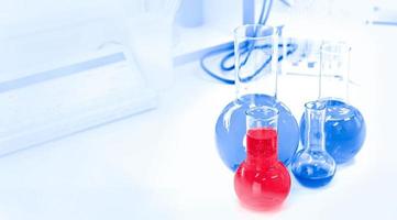 test tubes with chemical liquids, chemical and biological background photo