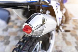 Enduro motorcycle exhaust system close-up photo