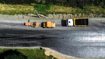 Aerial view on the new asphalt road under construction