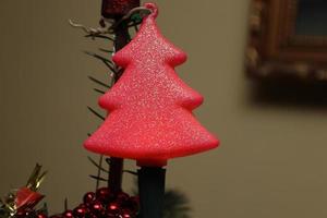 Christmas glitter globe found in a natural fir tree in the shape of a tree photo