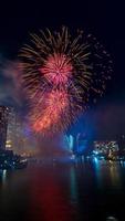 fireworks on the river in the dark sky photo