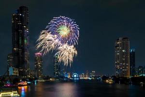 fireworks on the river in the dark sky photo