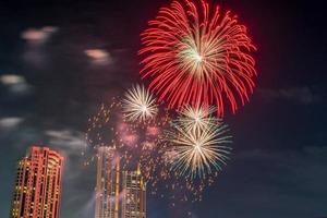 fireworks on the river in the dark sky photo