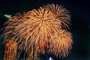 fireworks on the river in the dark sky photo