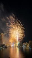 fireworks on the river in the dark sky photo