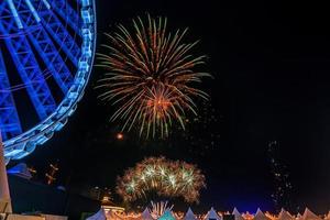 fireworks on the river in the dark sky photo