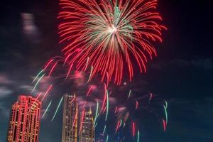 fireworks on the river in the dark sky photo