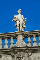 Palazzo Maffei with statue of divinitiy at Piazza delle Erbe in Verona, Italy photo
