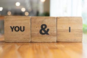 Word You and I. You and I blocks. The word love formed with small wooden blocks. selective focus. photo