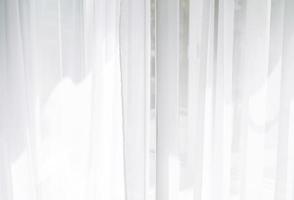 cortinas de tul blanco en la textura de fondo de la ventana foto