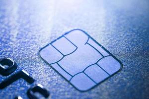 Electronic contactless credit card with selective focus microchip. Macro of a credit card. photo