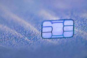 Electronic contactless credit card with selective focus microchip. Macro of a credit card. photo