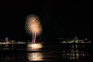 Abstract colored firework background light up the sky with dazzling display photo