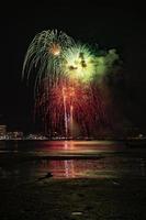 Abstract colored firework background light up the sky with dazzling display photo