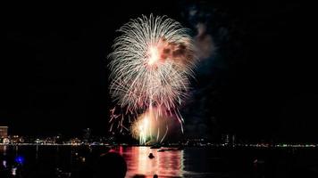 Abstract colored firework background light up the sky with dazzling display photo