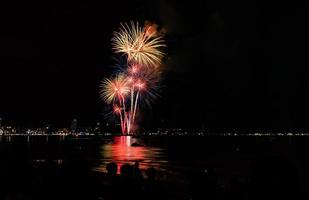 Abstract colored firework background light up the sky with dazzling display photo