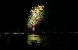 Abstract colored firework background light up the sky with dazzling display photo