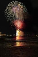 Abstract colored firework background light up the sky with dazzling display photo