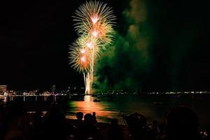 Abstract colored firework background light up the sky with dazzling display photo
