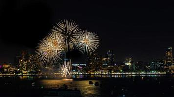 Abstract colored firework background light up the sky with dazzling display photo
