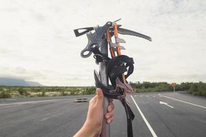 Close up female holding climber equipment concept photo