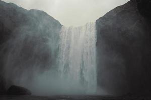 Wonderful waterfall on steep rock landscape photo