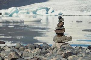 Close up rocks stack on sea coast concept photo