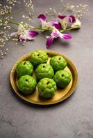 Sitafal peda or pera or custard apple shape designer sweet mithai barfi or burfi photo