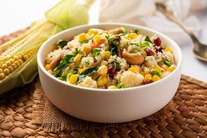 Sweet Corn Upma, makai rava uppittu made using with or without semolina , healthy Indian breakfast photo