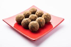 Bajra Atta Ladoo or kuler laddoo - Millet Flour Laddu, a popular winter sweet snack food from India photo