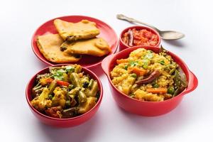 Bengali Bhog food for Indian Hindu Durga Puja or pooja festival. Khichadi, labra, tomato chutney photo