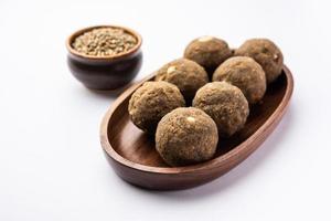 Bajra Atta Ladoo or kuler laddoo - Millet Flour Laddu, a popular winter sweet snack food from India photo