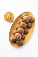 Fenugreek or methi ke Laddu, laddo or laddoo or sweet mithai balls for boosting immunity in winters photo