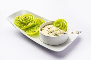 Rabdi Jalebi - Green jilebi or imarati with Rabri made from condensing milk, Indian dessert photo