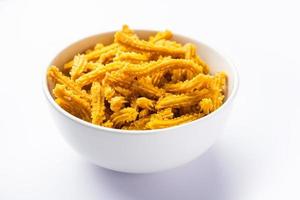 Bhajni chakli sticks or crunchy murukku snack made using diwali festival, favourite munching food photo