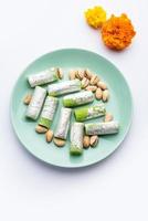 Pista Roll Or Pistachio Rolls Mithai or sigar, Indian sweet or dessert for festivals photo