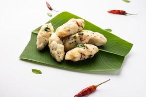 Kozhukatta Pidi is a steamed snack food from kerala rice flour with finger impressions photo