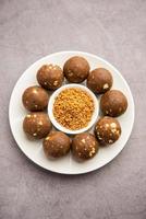 Fenugreek or methi ke Laddu, laddo or laddoo or sweet mithai balls for boosting immunity in winters photo