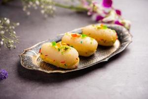 Malai Chop or Cream sandwich made using filling Rasgulla or Gulab jamun sweet is a Bengali sweet photo