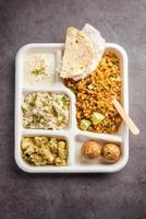 Indian Upwas thali, fasting food platter or thali for home delivery or takeaway parcel for any Vrat photo