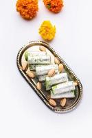 Pista Roll Or Pistachio Rolls Mithai or sigar, Indian sweet or dessert for festivals photo