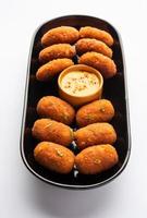 Macher Chop - Bengali style fish cutlet or pakora, a popular festival snack from west Bengal photo