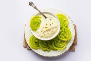 Rabdi Jalebi - Green jilebi or imarati with Rabri made from condensing milk, Indian dessert photo