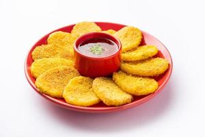 crispy potato rava fried slices or batatyache kaap or batata semolina fry snacks from India photo